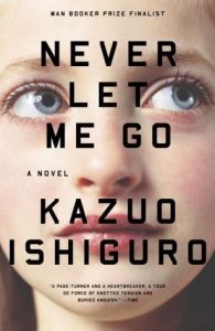 Book Cover for Never Let Me Go: the lettering of the novel's title, behind which can be seen a young woman's face